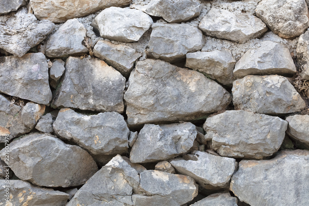 Stone wall from a large cobblestone sandstone close-up Stone wall from a large cobblestone sandstone close-up