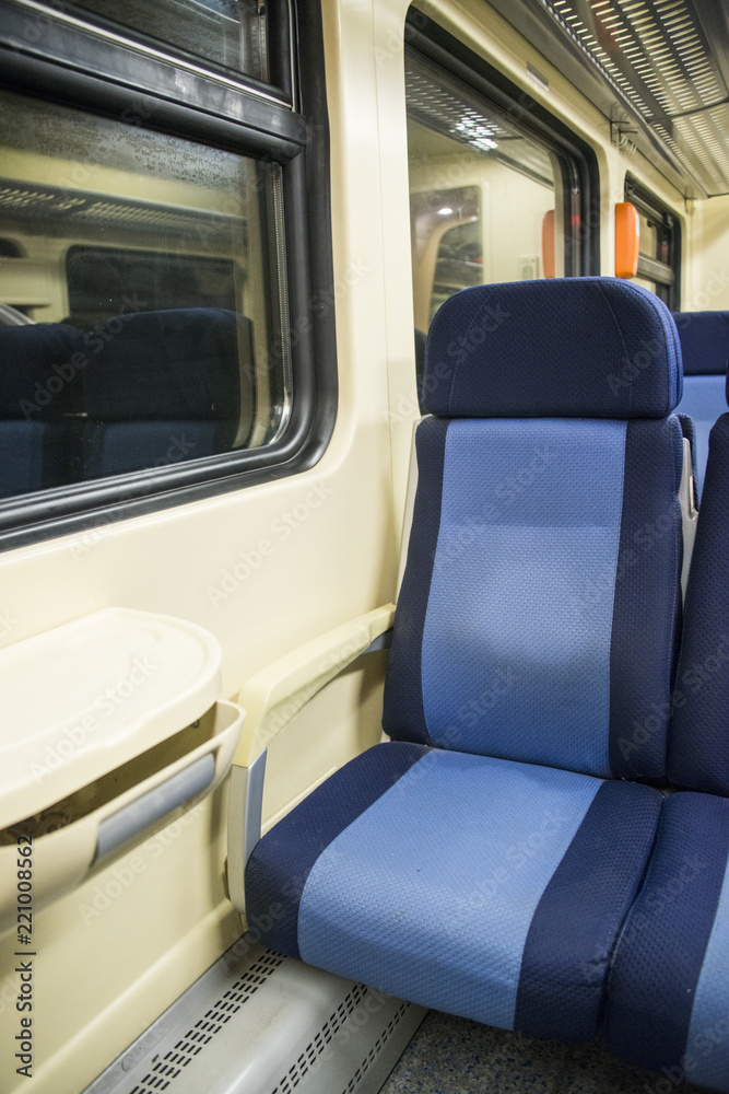 Red blue comfortable seats on the train,