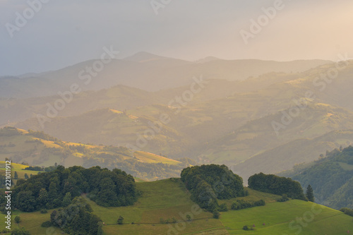 Stunning nature with misty landscape,Holbav village,Carpathians,Transylvania,Romania,Europe photo