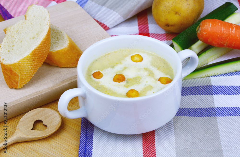 Squash Zucchini Potatoes and Carrot cream soup.
Vegetable soup in white bowl. Squash Zucchini Potatoes and Carrot cream soup.
Vegetable soup in white bowl.