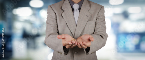 businessman workimg on VR blank wide touch screen computer on office blur background. photo