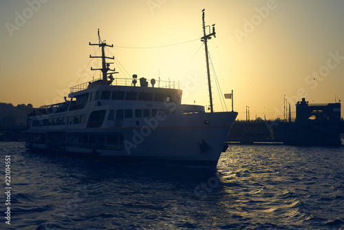 The passenger ship is on the Bosphorus in Istanbul. © badahos