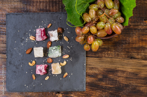 Sweets from grapes. Fresh green grapes. Flatlay. photo