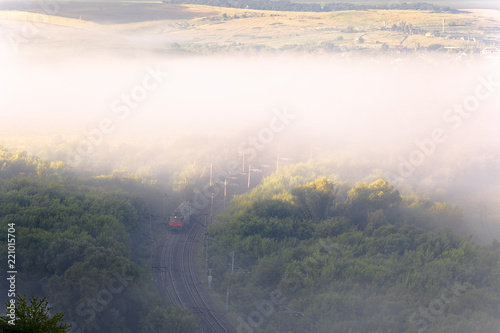 Trains under the cover of fog travel across the expanses of Russia © Sergey Oleynik 