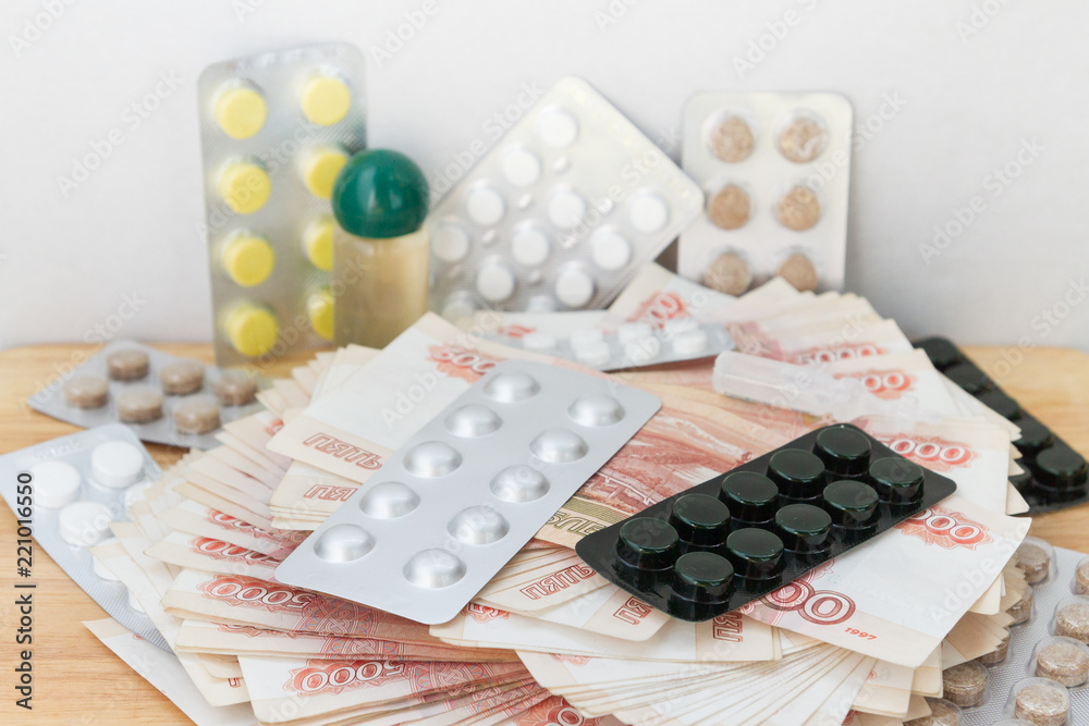 Pills and drugs with large Russian money lie on the table Pills and drugs with large Russian money lie on the table