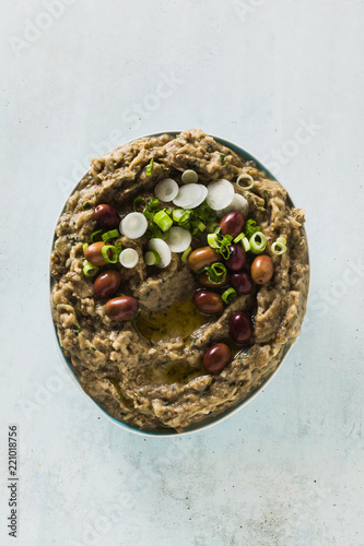 Appetizer with baba ganush of eggplant, olives from kalamata, green onions and fresh rye bread. Mediterranean snack. Vegan healthy food photo