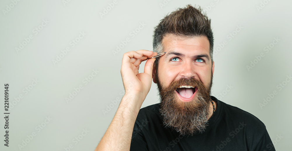 Eyebrow Correction. Closeup Of Beautiful Funny Man Plucking Eyebrows.  Portrait Of Sexy Male With Beard Model Face And Tweezers Near Brows. Beauty  Concept. High Resolution Stock Photo | Adobe Stock