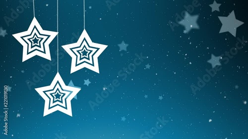 Snowfall and hanging Christmas stars on blue copy space background. Greeting card. photo
