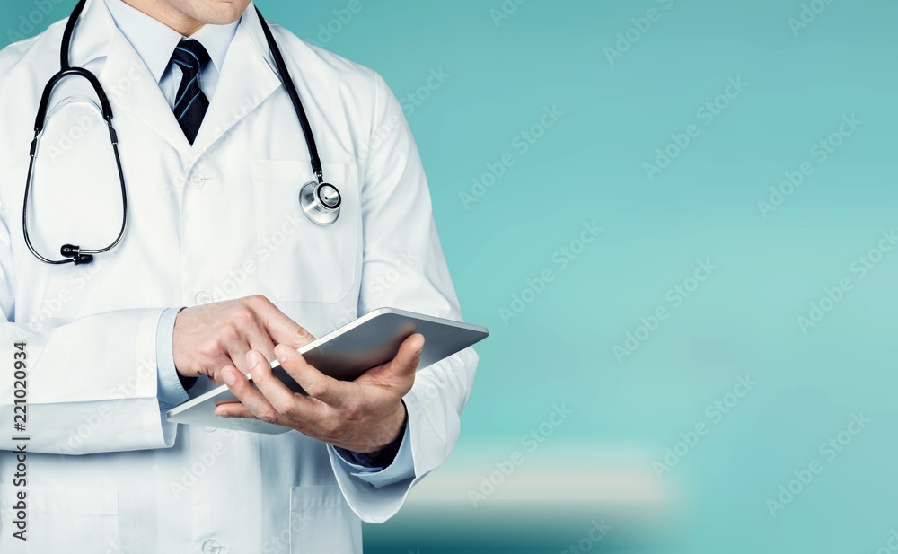 Close-up Doctor at hospital working with tablet pc Close-up Doctor at hospital working with tablet pc