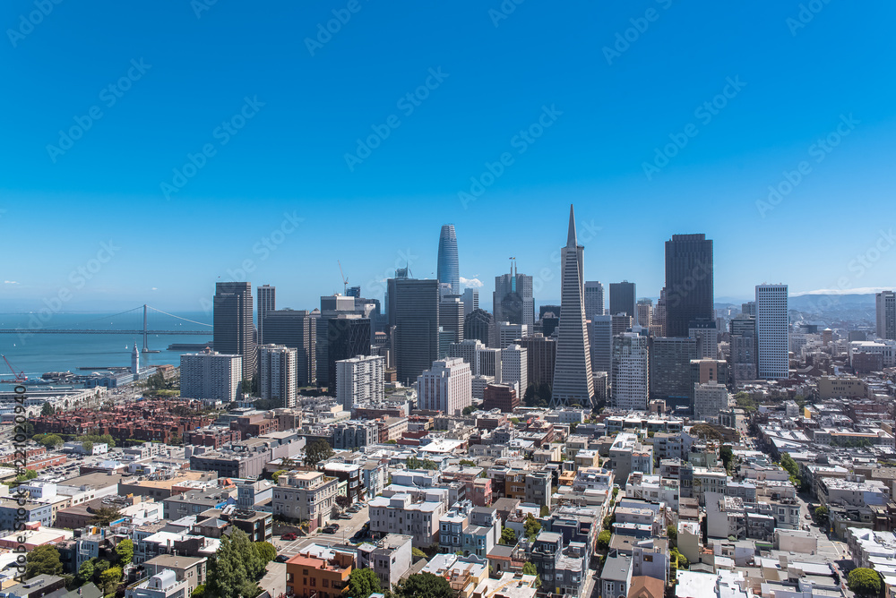 Fototapeta premium San Francisco, panorama of Financial District downtown and the Oakland Bay Bridge in background 