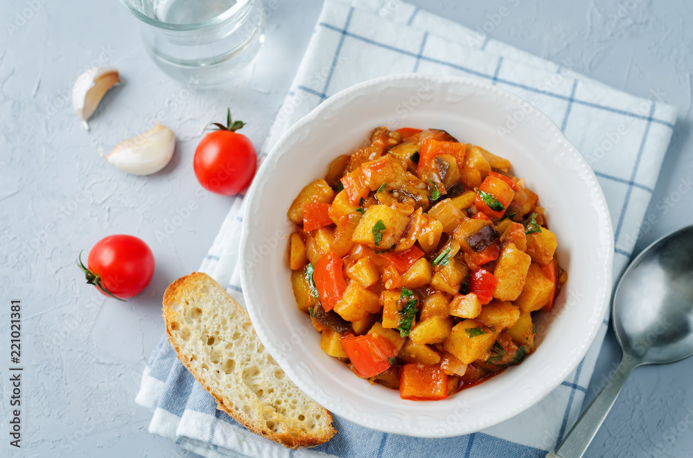Eggplant potato Bell pepper goulash with bread slices