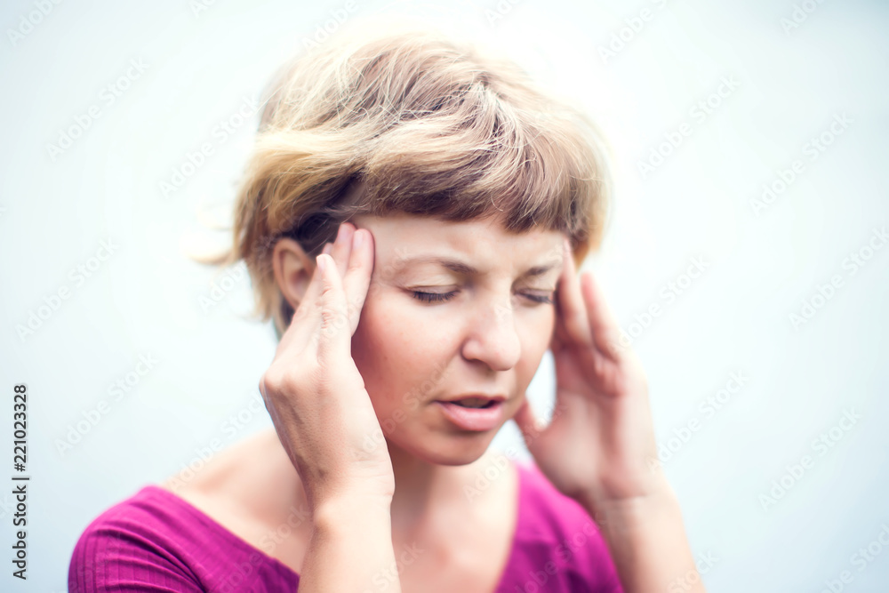 Young woman suffering from headache on white background. Medicine, healthcare and people concept Young woman suffering from headache on white background. Medicine, healthcare and people concept