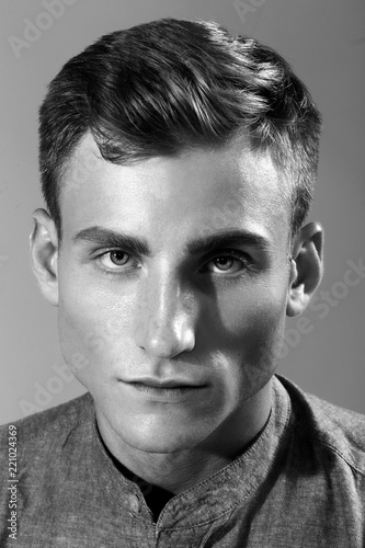 Handsome man posing in the studio for clothes shooting