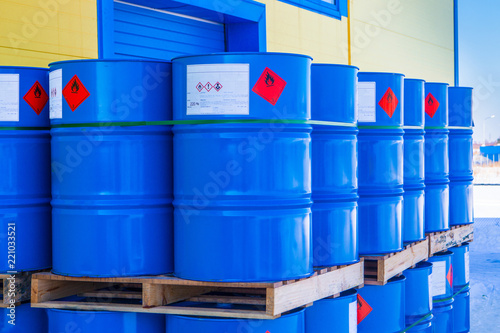 Barrels. Warehouse of chemical products. The metal barrels are blue. Chemistry. Manufacture of chemicals. Pallets with barrels.