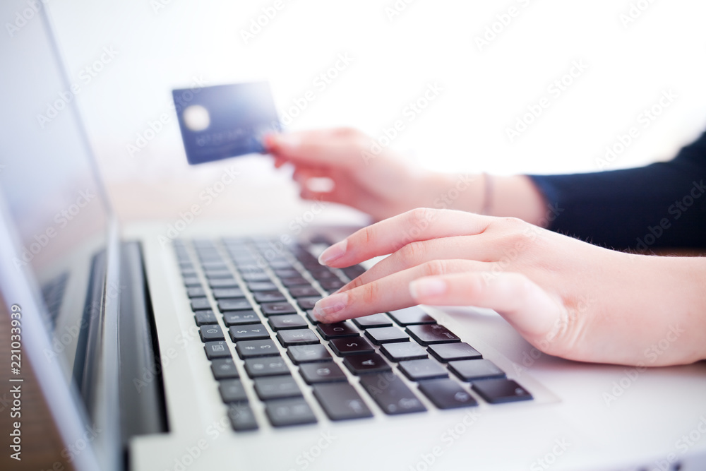 female hands holding credit card and using laptop for online shopping
female hands holding credit card and using laptop for online shopping
