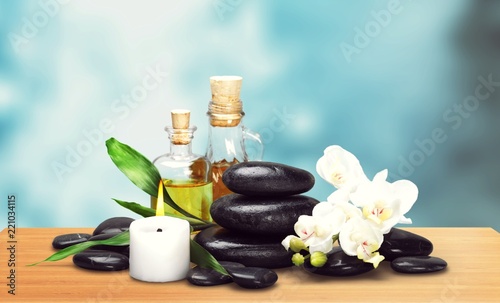 Zen basalt stones and aroma oil on the white