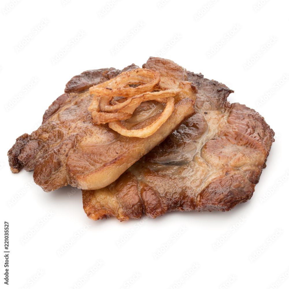 Cooked fried pork meat with onion slices garnish isolated on white background cutout