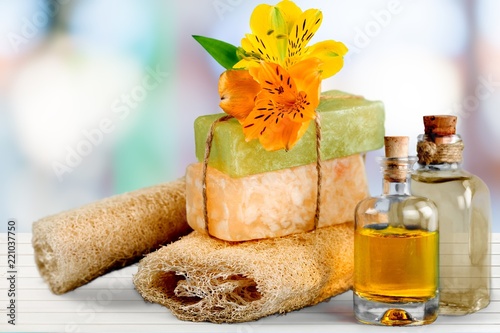 Healthy spa concept with handmade soap bars  oil bottles  sponge