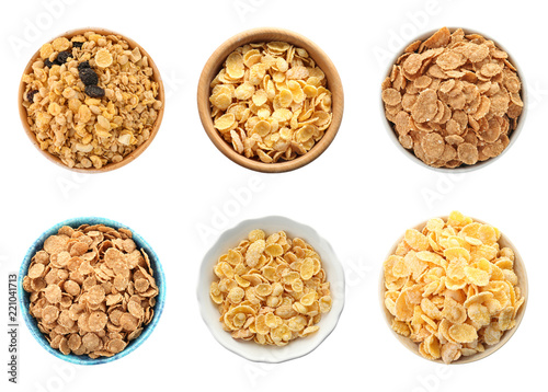 Set with bowls of breakfast cereals on white background, top view. Healthy whole grain recipe
