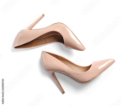 Pair of beautiful shoes on white background, top view