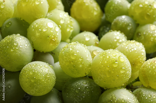 Bunch of green fresh ripe juicy grapes as background. Closeup view