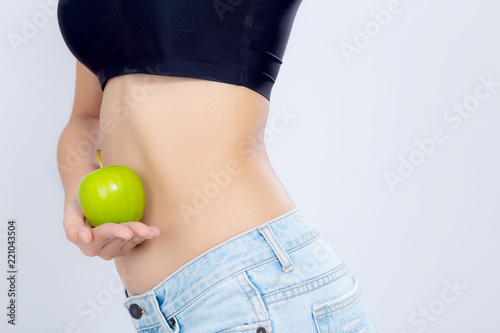 beautiful body woman sexy slim holding green apple with cellulite for wellness, girl waist thin with fitness for weight loss and healthy isolated on white background, healthcare and diet concept.