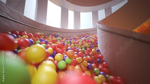Countless colorful balls falling down contemporary orange spiral stairs. 4K HD photo