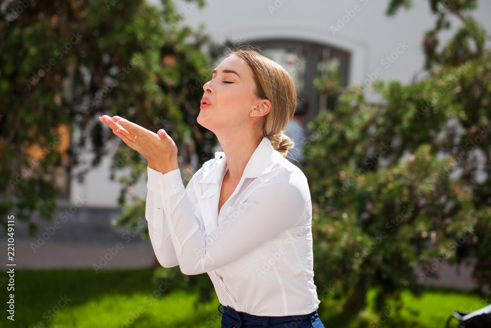Blow kiss, young caucasian female haired model Blow kiss, young caucasian female haired model