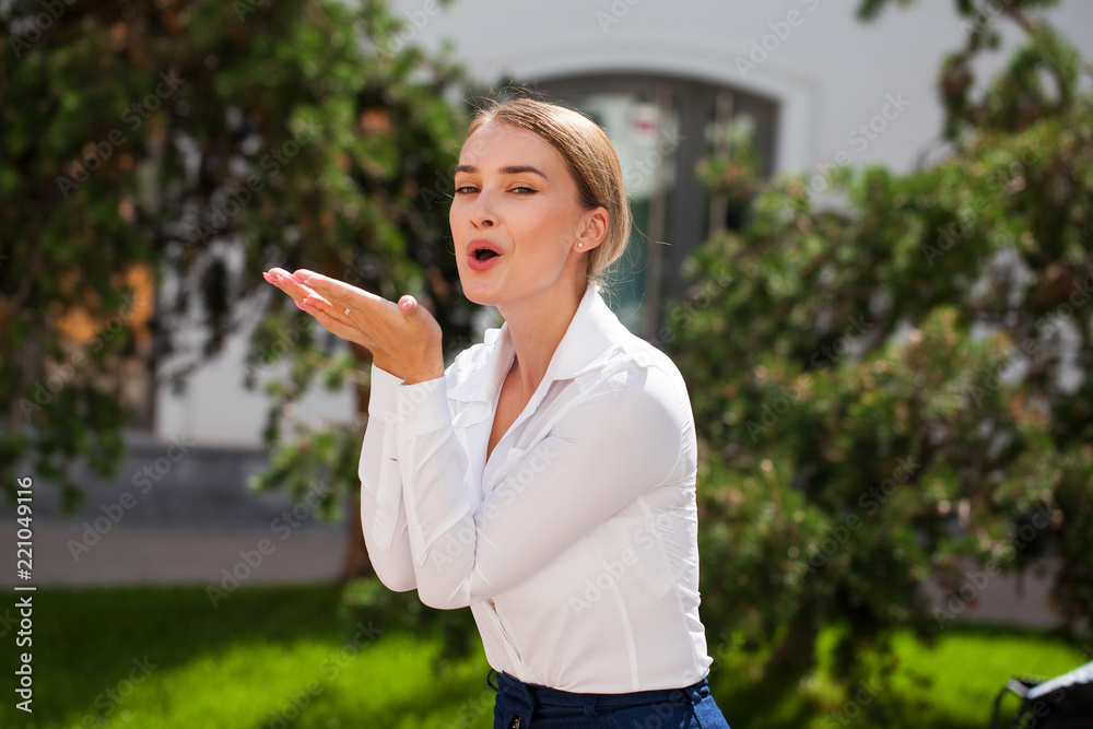 Blow kiss, young caucasian female haired model Blow kiss, young caucasian female haired model
