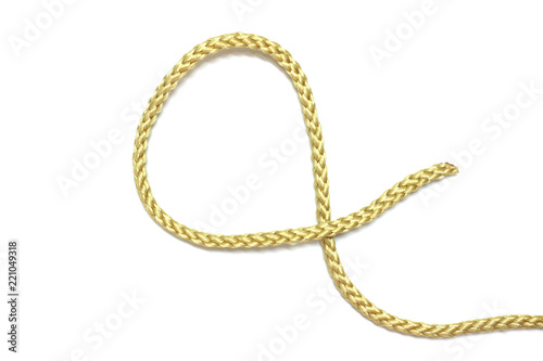 close up of gold rope on white background © naiauss