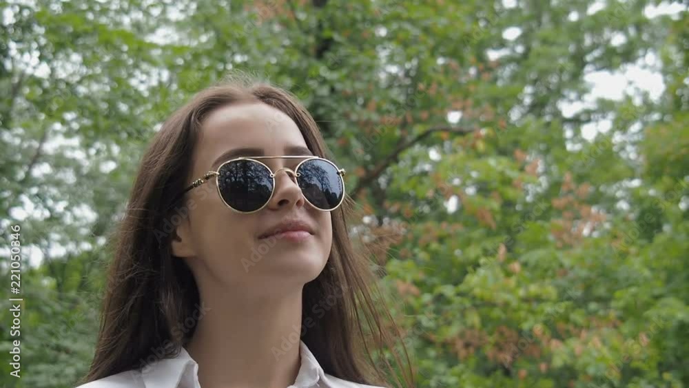 Portrait of a beautiful teenage girl. Teen girl in sunglasses.