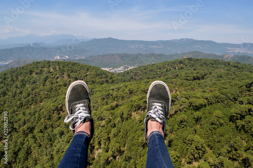 Feet on top of an aerial view of Valle de Bravo at Mexico