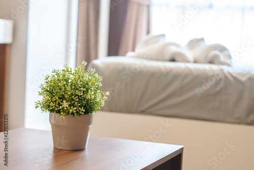 Vase of flowers on the table with furniture background © auttachod