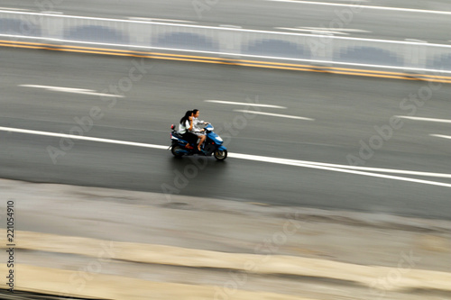 A motorcycle speeding along the road