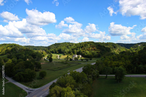 Over looking mansion and green fields with horses with hills behind Natchez Trace parkway photo