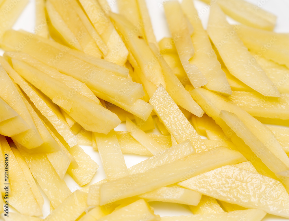 raw french fries on a white plate raw french fries on a white plate