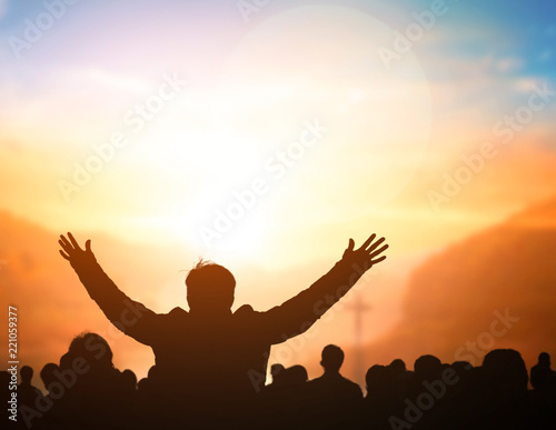 Fototapeta Naklejka Na Ścianę i Meble -  Praise and worship concept:Silhouette of Christian prayers raising hand while praying to the Jesus