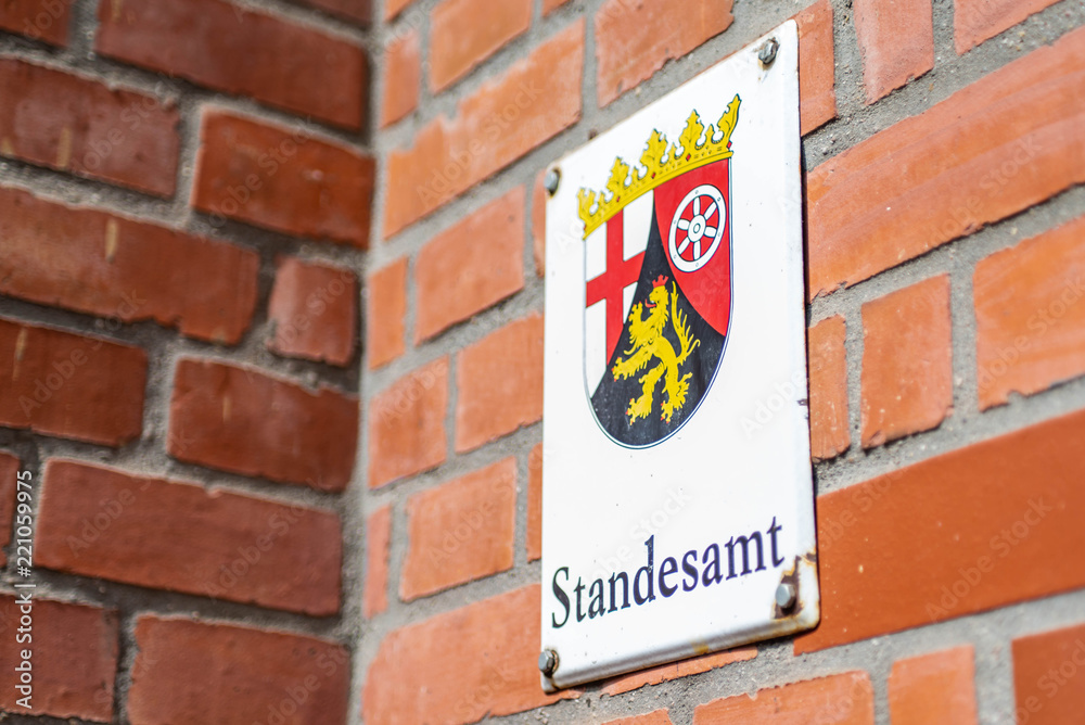 Fototapeta premium Metal Sign mounted wall German word Standesamt translation register office emblem of german Region Rhineland Palatino