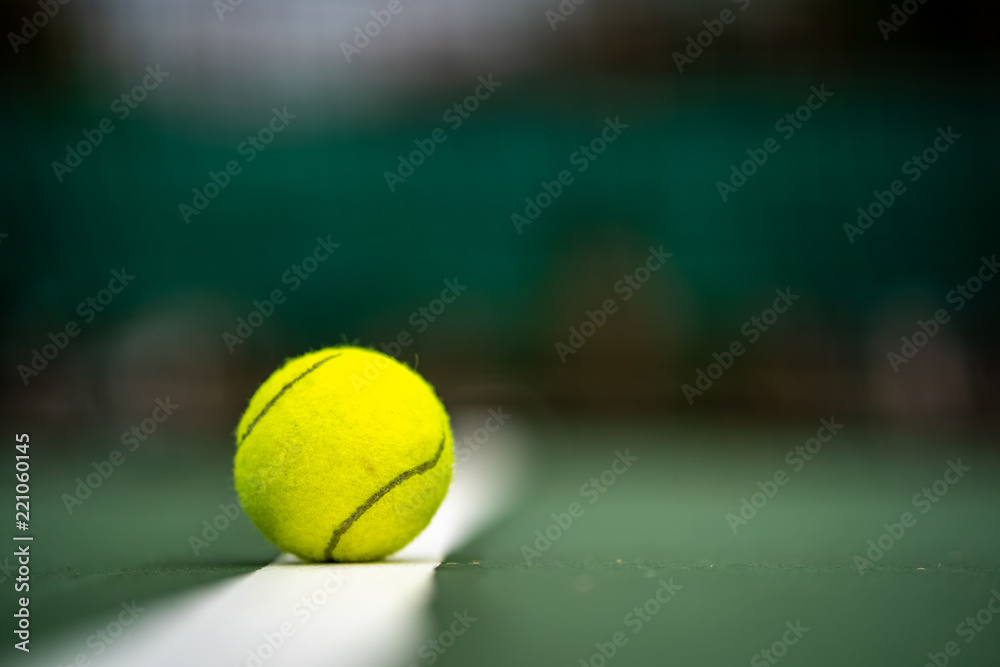 The beginning of a champion, Close up tennis ball on the courts background.