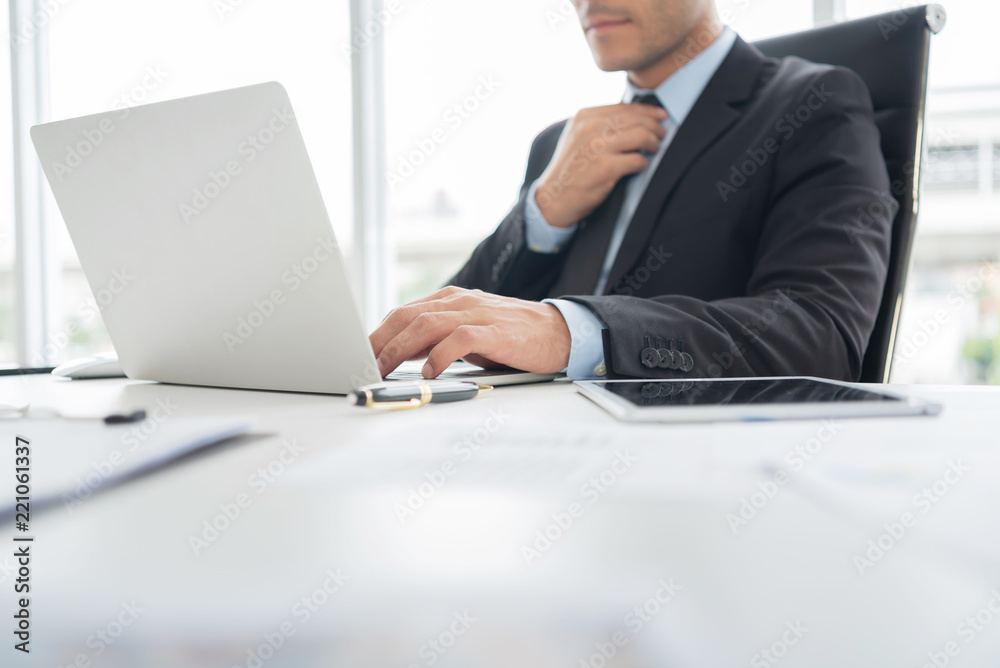 Confident Businessman is working on Laptop computer. Confident Businessman is working on Laptop computer.