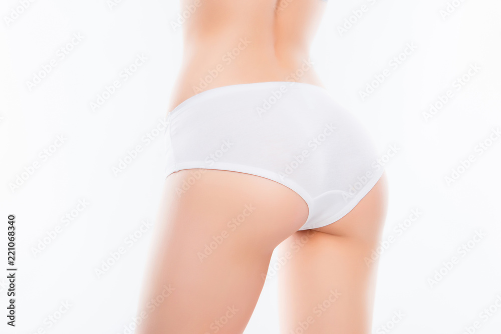 Close up photo of fit woman's ass with perfect ideal skin in whi Close up photo of fit woman's ass with perfect ideal skin in whi