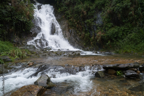 Fototapeta Naklejka Na Ścianę i Meble -  Aerial View of Waterfall in the Tropical Rainforest Mountains