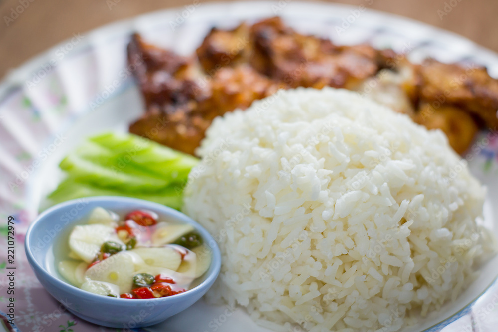 Fried Chicken and Rice in Plate on Wooden Floor ,fast food,in thailand Fried Chicken and Rice in Plate on Wooden Floor ,fast food,in thailand