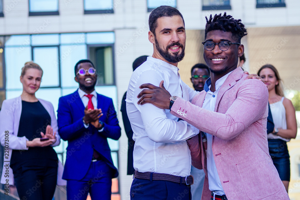 Multiracial african and caucasian men handshaking at meeting and making deal shaking hands to white businessman multinational and multiethnic corporate business people . Greeting Deal Concept