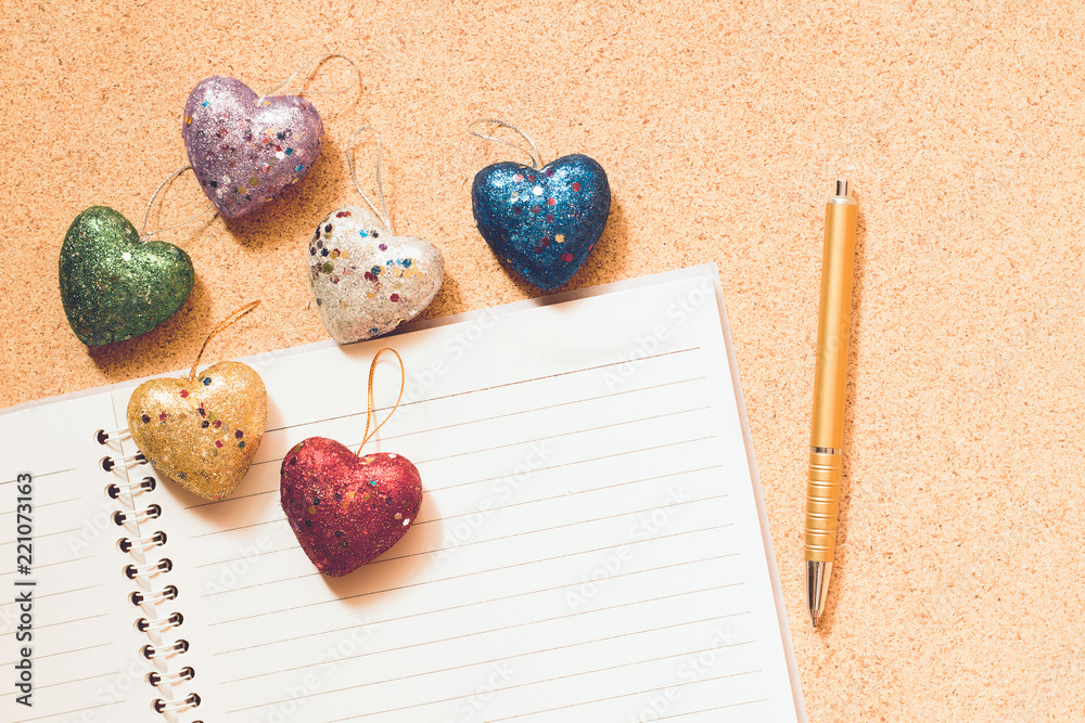 Valentines Day concept, heart, notebook and golden pen on wood table. Valentines Day concept, heart, notebook and golden pen on wood table.