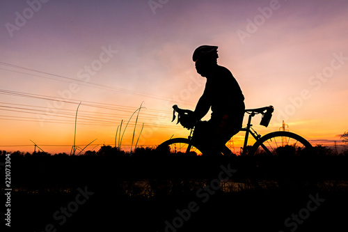Silhouette of Men s Cycling At sunset