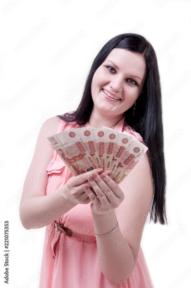 Brunette girl in pink blouse holding money in hands Brunette girl in pink blouse holding money in hands