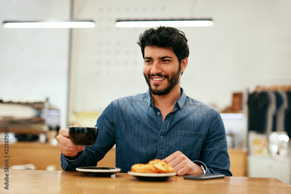 Man Drinking Coffee In Cafe Man Drinking Coffee In Cafe