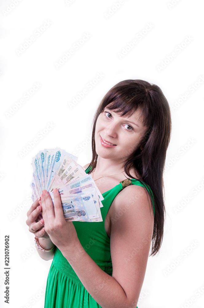 Happy brunette girl in green dress holding money Happy brunette girl in green dress holding money
