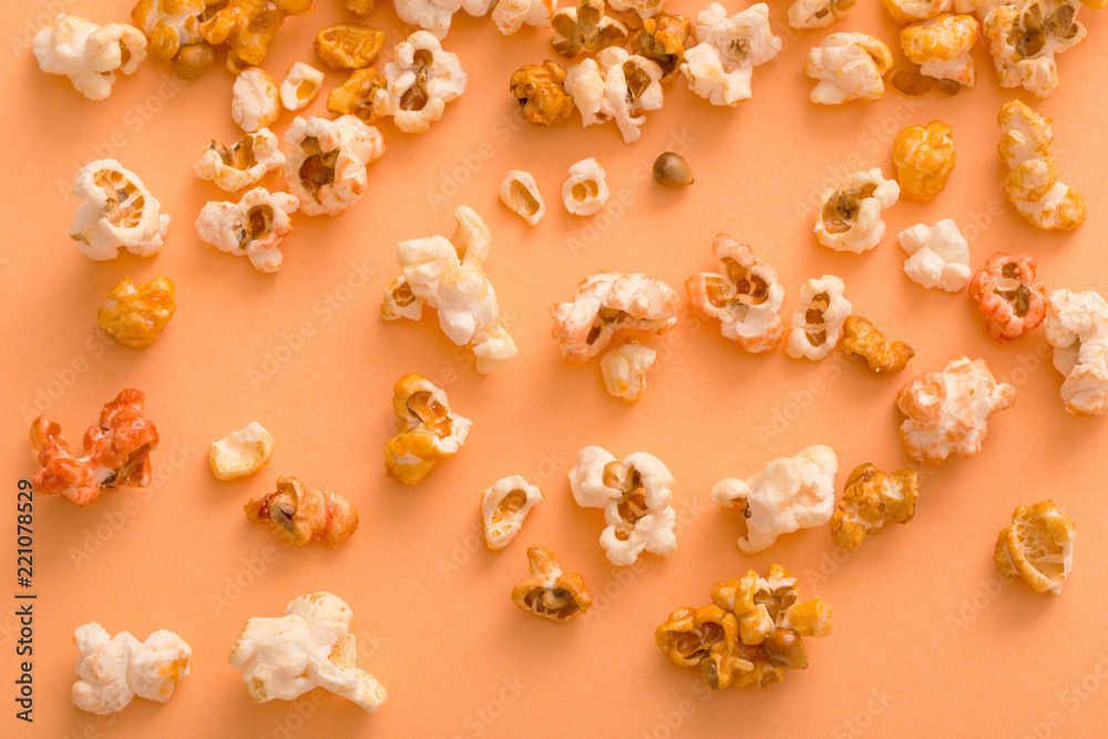 pop corn on orange background pop corn on orange background